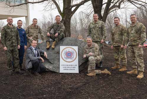 The Center for Law and Military Operations consists of a joint, interagency, and multinational team of
        operational law experts (Dr. Ganschow in civilian attire). (Credit: Billie Suttles, TJAGLCS)